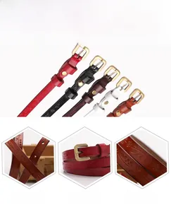 Close-up showing floral embossed leather texture and golden D-ring buckle on narrow belt