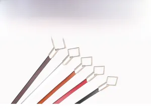 Fan-shaped display of slim leather belts for women in five classic colors with gold buckles