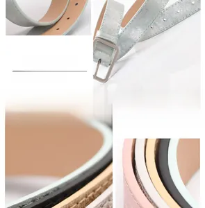 Detail of slim PU leather belts with metallic finish and silver square buckles
