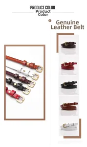 Detailed close-up of genuine leather belts with floral embossing and gold metal buckles
