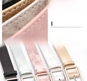 Detailed view of colorful slim PU leather belts with precision stitching and metal buckle