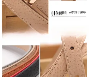 Dettagli di cinture sottili in ecopelle con texture struzzo e fibbie in lega dorata lucida