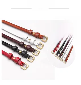Detail of elegant alloy buckle with embossed pattern on high-quality leather belts for women