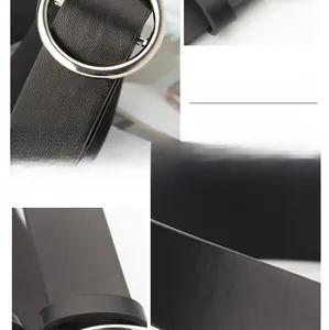 Close-up of black litchi grain leather belt with a silver round alloy buckle detail