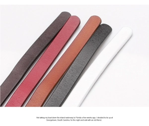 Detail view of five assorted leather waist belts featuring fine litchi grain and alloy buckles
