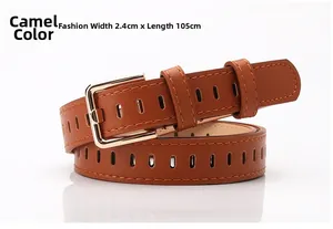 Detail of camel faux leather belt with golden square buckle and hollow oval pattern