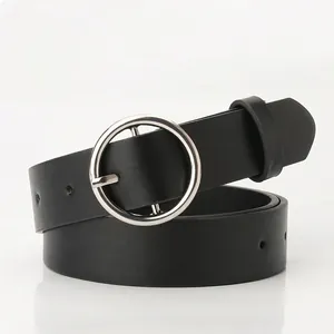 Classic black women leather belt with round silver buckle for jeans, minimalist style