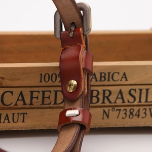 Premium dark brown genuine leather belt for women featuring a vintage metal buckle and studs
