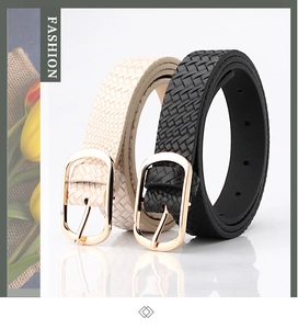 Detail of woven leather belts for women with oval gold metal buckles in black and beige