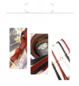 Détail de la boucle ronde en métal sur la ceinture fine en cuir de diverses couleurs