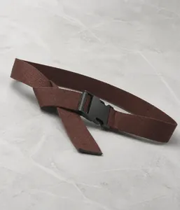 Detail of coffee brown canvas belt with high-density fabric and durable plastic buckle