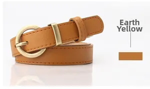 Detail of tan faux leather belt showing textured finish and vintage gold round buckle