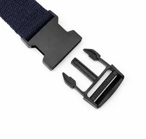 Detail of navy canvas belt showing the durable black plastic quick-release buckle