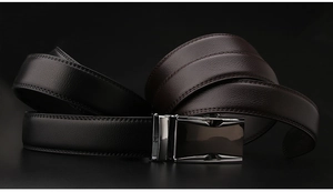 Detailed view of men's genuine leather belts with lychee texture and silver automatic buckle