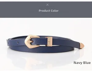 Detail of navy blue PU skinny belt featuring a vintage engraved matte gold buckle