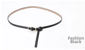 Close-up of slim black leather belt featuring a modern gold double-ring buckle for women