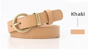 Detail of khaki leather belt with white stitching and round metal pin buckle for women
