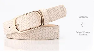 Detail of beige woven texture leather belt featuring a classic golden pin buckle