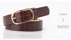 Close-up of coffee brown leather belt featuring stone texture and gold metal buckle