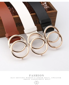 Detail of classic women's waist belts with round gold alloy buckles in brown and black