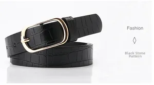 Detail of stone pattern black leather belt with golden oval buckle and fine texture