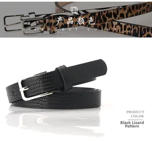 Close-up of leopard print and lizard texture skinny belts with silver square buckles