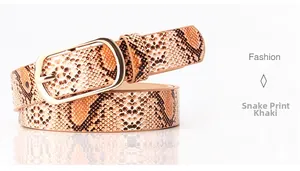 Detail view of khaki faux leather belt with snake skin texture and gold oval buckle
