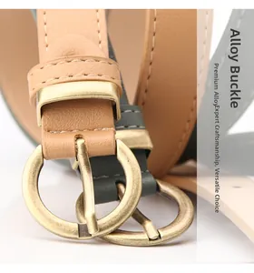 Detail of alloy pin buckle and textured leather belt strap with fine stitching