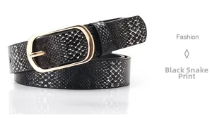 Detailed close-up of a black snake pattern belt with a polished gold rectangular buckle