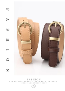 Detail of classic women leather belts with round metal buckles in khaki and dark brown