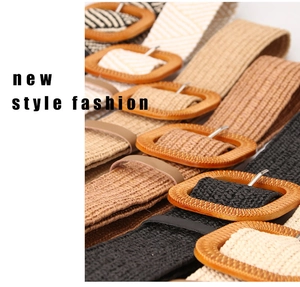 Close-up of woven straw belts with square buckles in black, khaki, and ivory colors