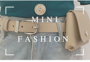 Detail of apricot faux leather belt with mini pouch and silver buckle on jeans
