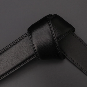 Men's black leather belt with lychee texture and stitching on dark minimalist background