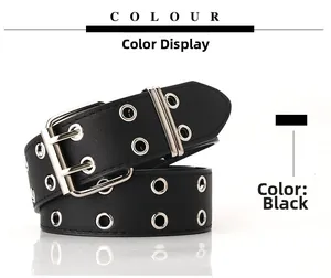 Détail d'une ceinture punk noire avec deux rangées d'œillets en métal argenté et une boucle