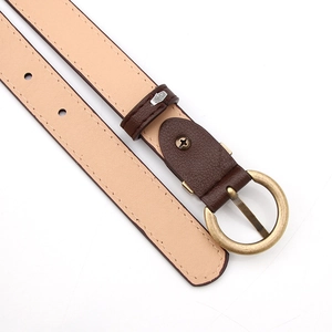 Detail view of dark brown leather belt with vintage gold round buckle and neat stitching