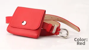 Detailed close-up of a red leather belt bag with silver metal buckle on white surface