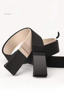 Detail of adjustable black and khaki nylon canvas belts with matte automatic buckles