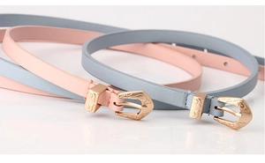 Detail of pink and blue matte belts featuring vintage engraved gold alloy buckles