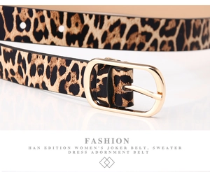 Close-up of leopard print belt with golden oval pin buckle for women dresses