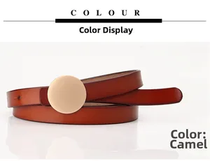 Detailed view of the camel leather slim belt featuring a matte gold round buckle