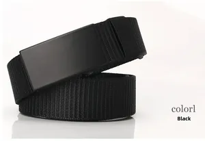 Detail of black nylon woven belt featuring a matte black metal buckle on white background