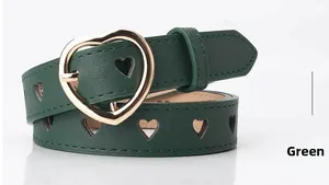 Detail of green PU leather belt showing heart-shaped gold buckle and hollow patterns