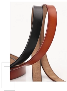 Detailed close-up of premium leather belts in black and brown showing refined textures