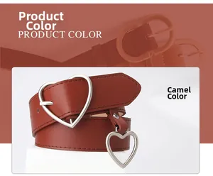 Close-up of camel leather belt featuring silver heart buckle and dangling heart charm