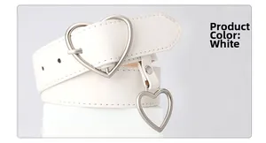 Close-up of white faux leather belt featuring a silver heart buckle and heart pendant detail