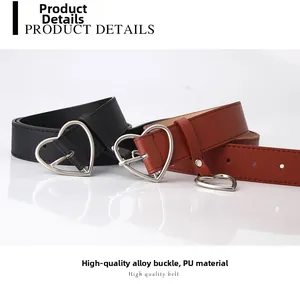 Close-up of the silver heart-shaped alloy buckle and premium PU leather belt texture
