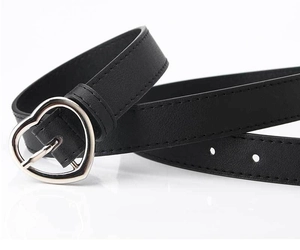 Detail of black leather belt featuring a silver heart-shaped metal buckle and neat stitching