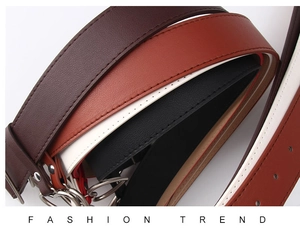 Detail of high-quality PU leather belts with fine stitching and silver metal rings