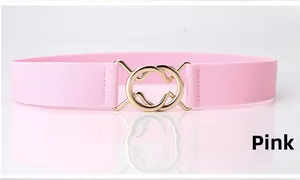Pink elastic waist belt featuring a modern interlaced golden round metal buckle detail