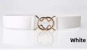 Detail of white elastic waist belt featuring a gold interlocking double ring buckle